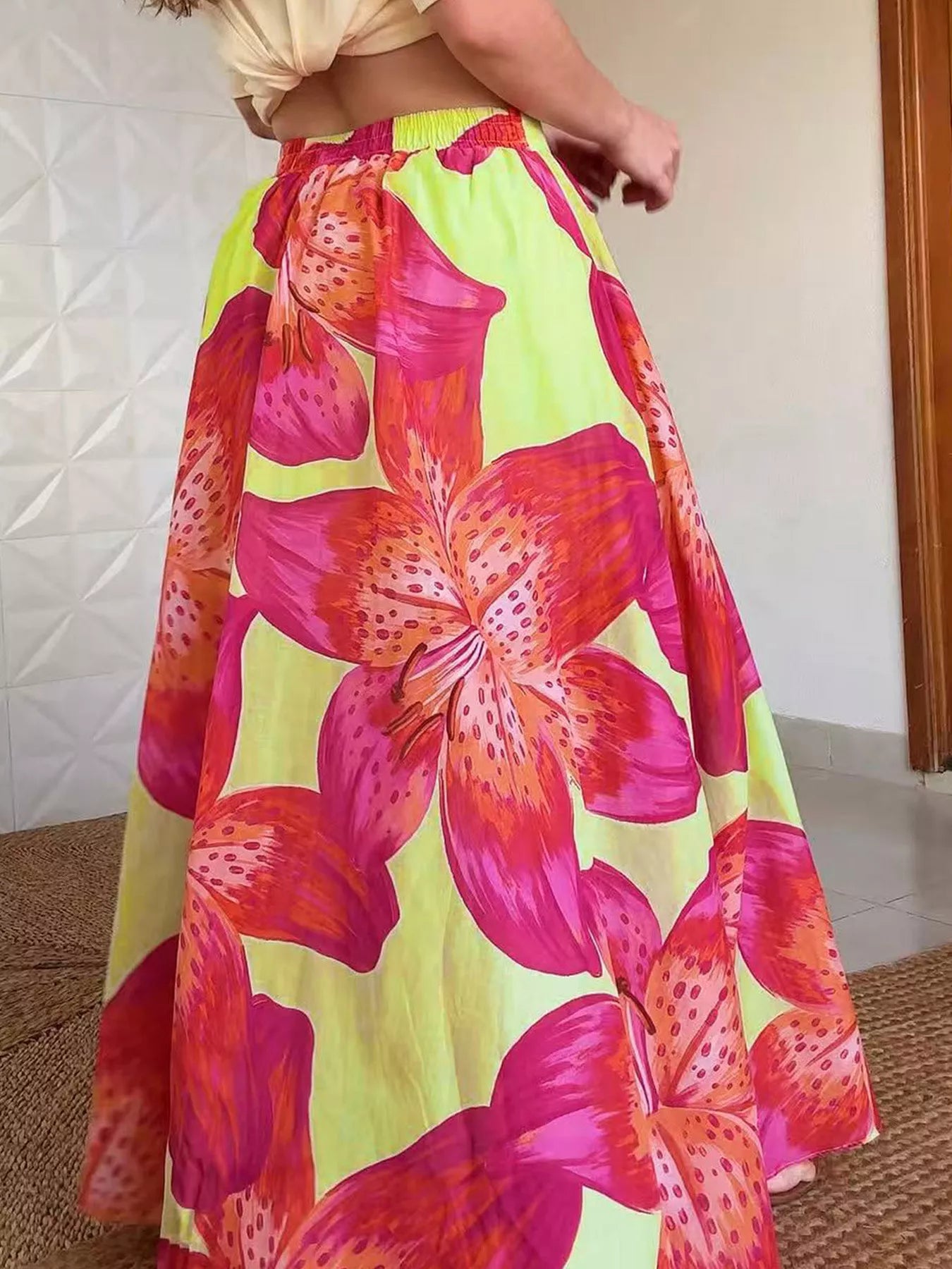 Women’s floral print flowy maxi skirt with pockets, lightweight boho style skirt by Trendsi, shown in a natural fabric and vibrant pattern.