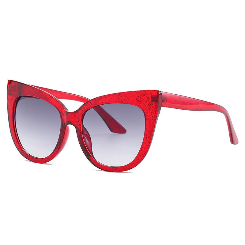 Women’s oversized cat eye sunglasses with UV400 protection from Plush Fashion Hub, stylish black frames and tinted lenses.
