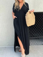 Plus size maxi dress with slit V-neck and smocked waist, featuring a flowy silhouette and trendy design from Trendsi.
