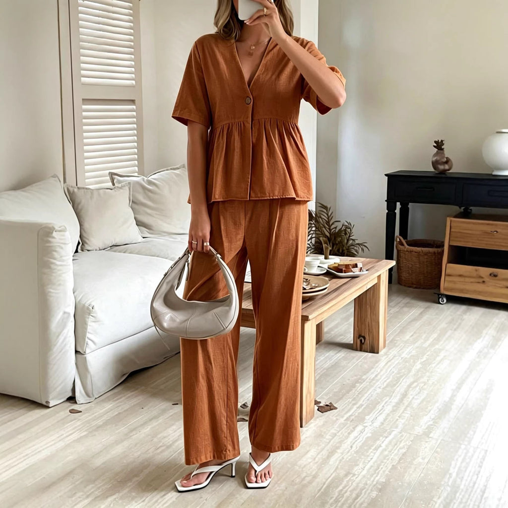 Women's FitiqueFit casualwear set featuring a V-neck loose short-sleeve top and wide-leg pants, stylish and comfortable.