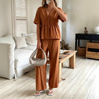 Women's FitiqueFit casualwear set featuring a V-neck loose short-sleeve top and wide-leg pants, stylish and comfortable.