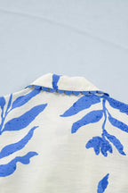 Leafy botanical print maxi dress with side tie and button-down front by Shopimist, featuring a flowing, elegant design.