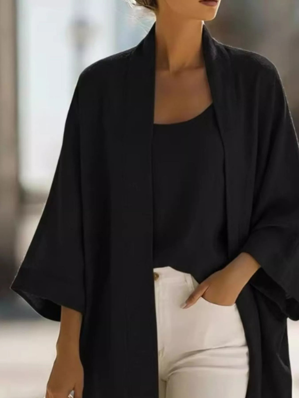 Plus size open-front cardigan and matching tank top set by Trendsi, featuring a stylish, comfortable layered look.