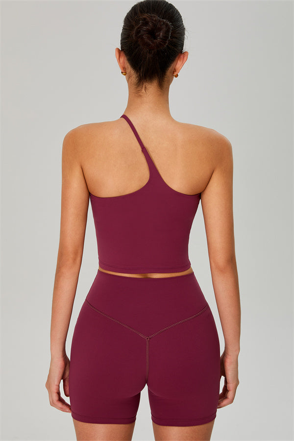 Fitglutes activewear one-shoulder crop top and matching shorts 2-piece gymwear set, designed for workout and sports activities.