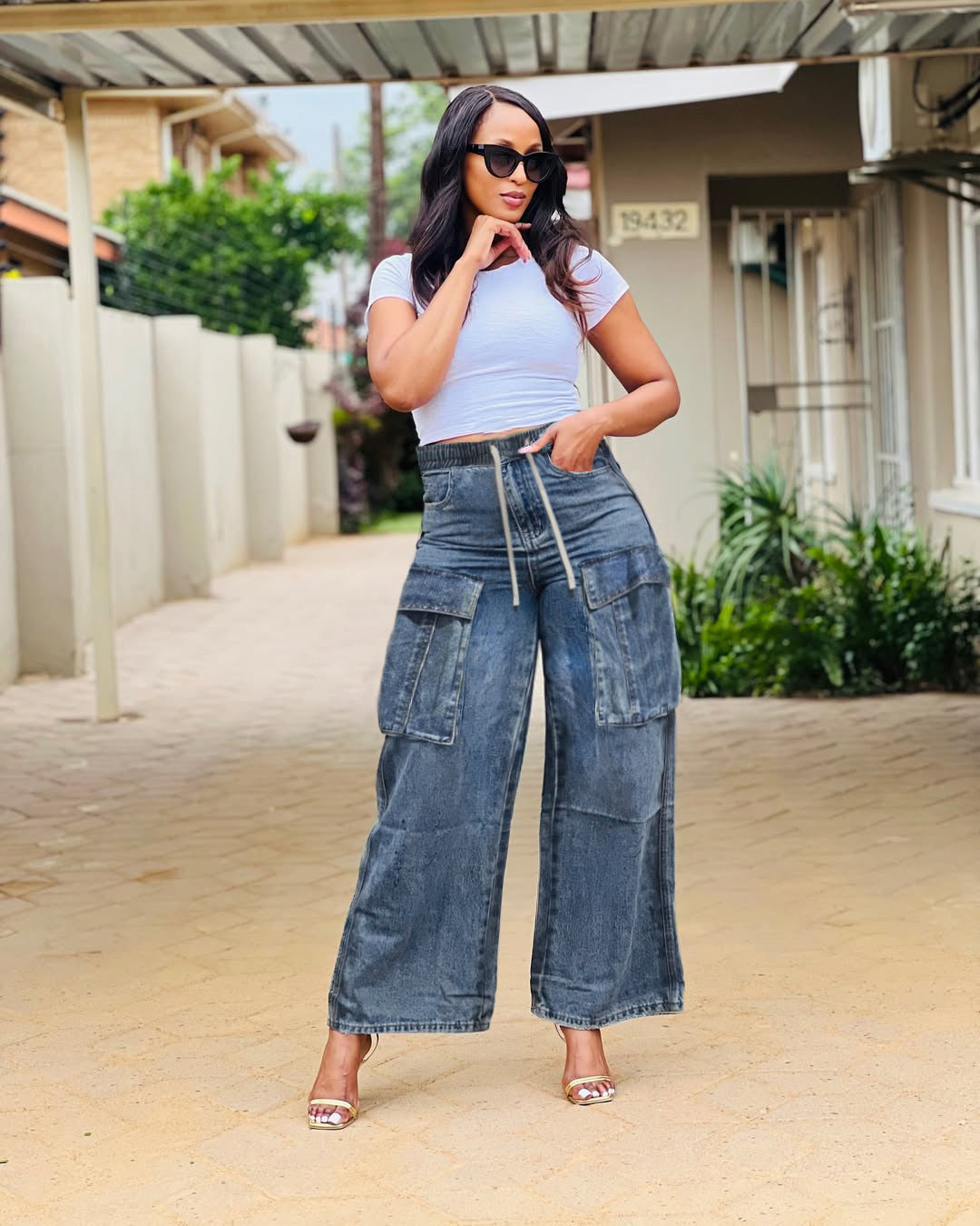 Wide-leg cargo jeans by Plush Fashion Hub featuring street style design, multiple pockets, and a relaxed fit.