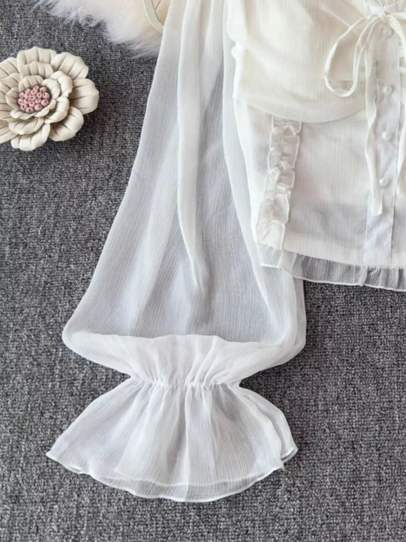 Women's elegant lightweight polyester blouse with frill flounce sleeves and smocked bodice, perfect for stylish, comfortable wear.
