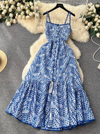 Eyelet embroidered tiered boho midi camisole dress in lightweight fabric, featuring summer-inspired design and floral details.