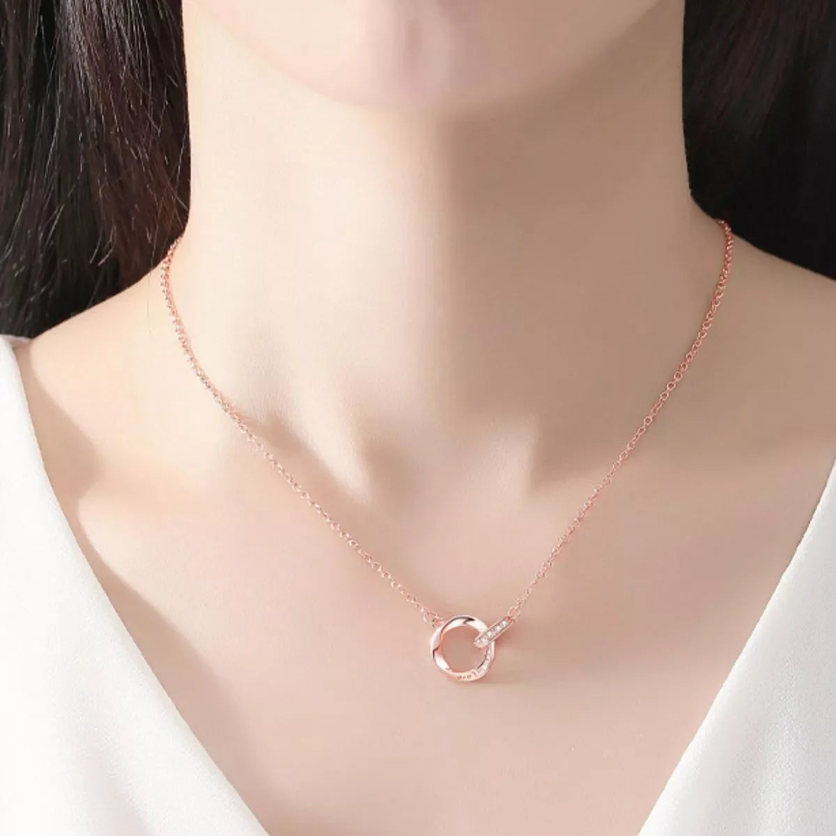 Sterling silver necklace with 18K rose gold plating, featuring a delicate chain and elegant design.