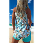 Women's plus size one-piece swimsuit by FitiqueFit featuring a stylish, supportive design and vibrant color pattern.