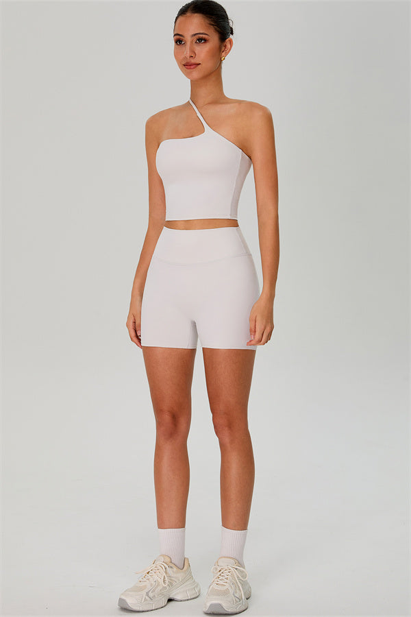 Fitglutes activewear one-shoulder crop top and matching shorts 2-piece gym set, stylish workout clothes for women.