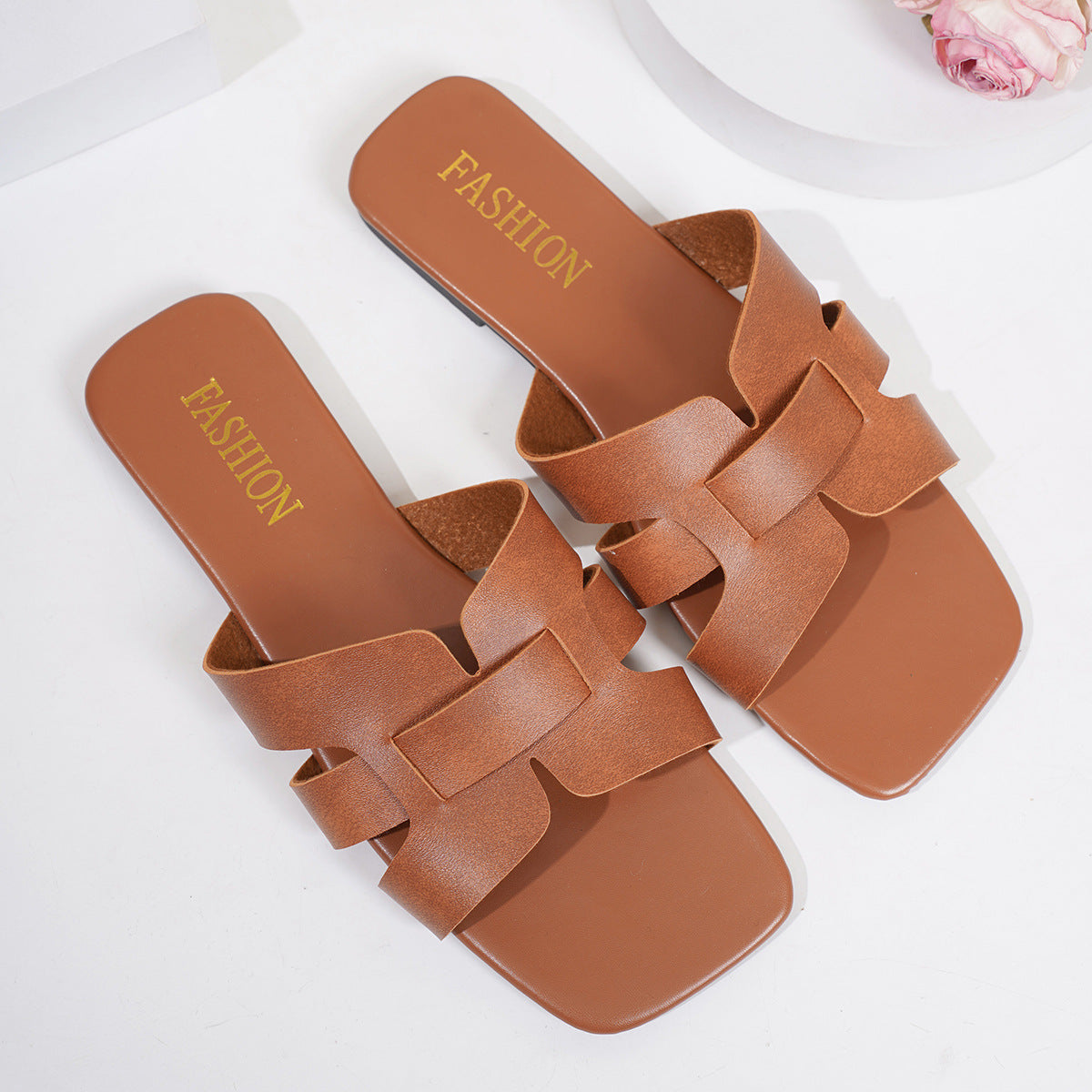 Shopimist woven strap slide sandals featuring a comfortable design and stylish woven detailing on the straps.