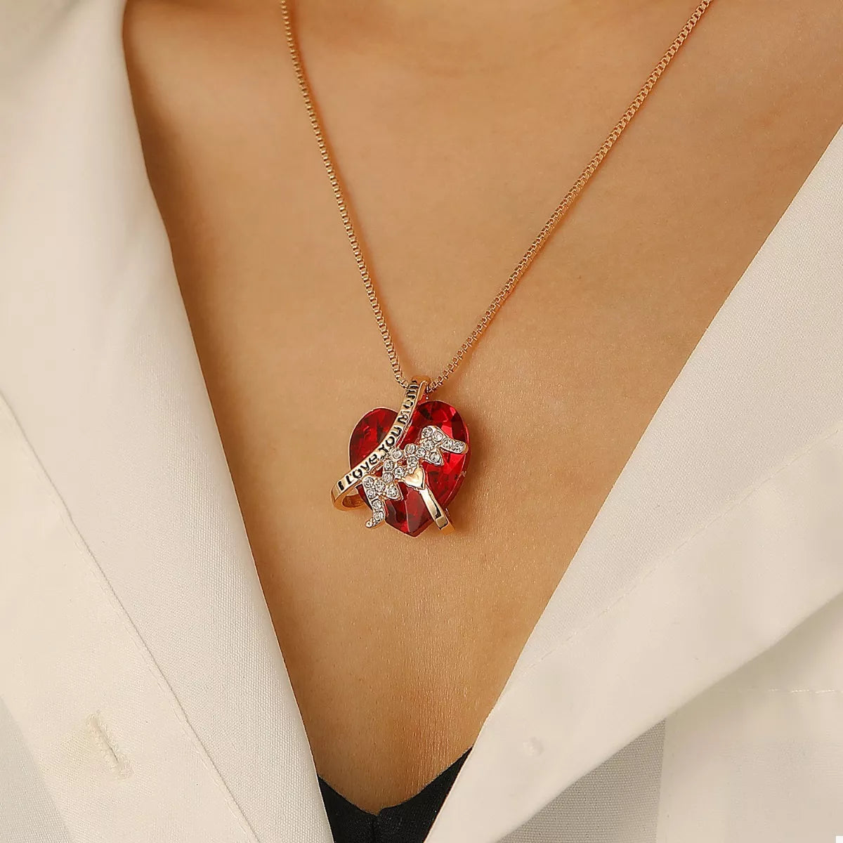 Heart-shaped MOM pendant necklace by Plush Fashion Hub featuring a silver-tone heart charm on a delicate chain.