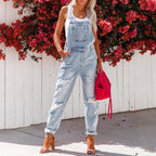 Women's cropped ripped denim overalls by FitiqueFit with strap bib detail, streetwear style, and distressed denim design.