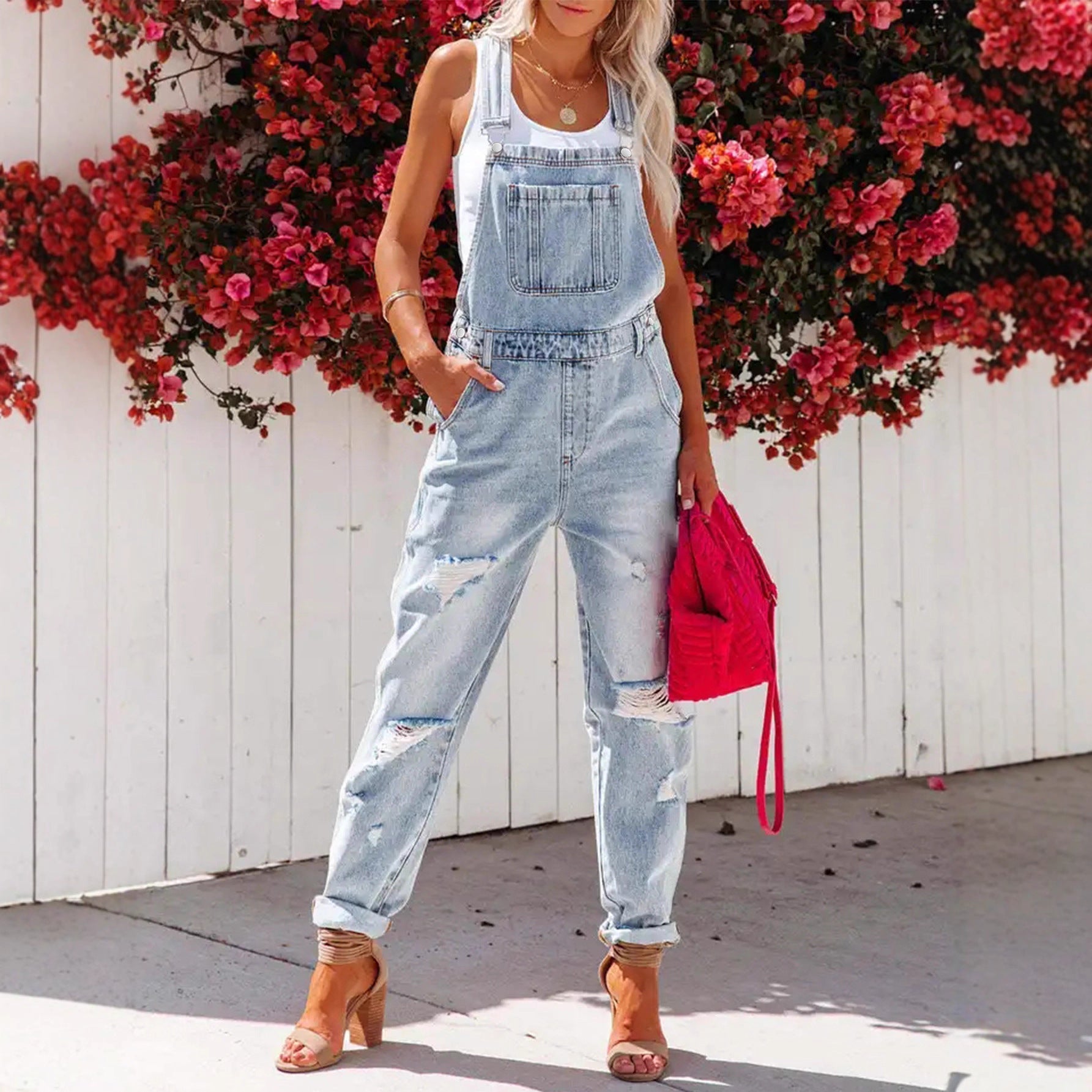 Women's cropped ripped denim overalls by FitiqueFit with strap bib detail, streetwear style, and distressed denim design.