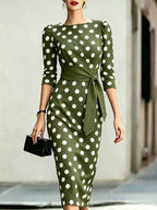 Women's retro polka-dot bodycon midi dress by FitiqueFit featuring a belted cross-tie waist, perfect casualwear with vintage style.