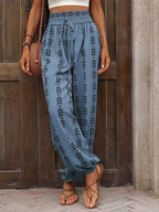 Printed high-waist pants from Trendsi with tie detail, featuring a stylish design and high-rise fit, perfect for casual or chic looks.
