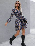 Floral layered surplice balloon sleeve dress in casualwear style by Plush Fashion Hub, featuring a feminine floral print and flowing silhouette.