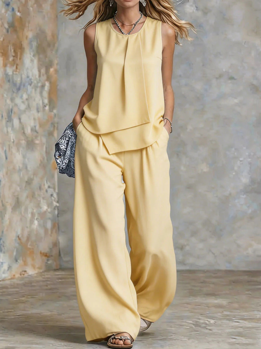Women's sleeveless two-piece set with solid color wide-leg pants and top from Plush Fashion Hub, displayed on a mannequin.