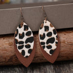 Leaf-shaped leather dangle earrings from Shopimist featuring natural leaf design and lightweight leather material.