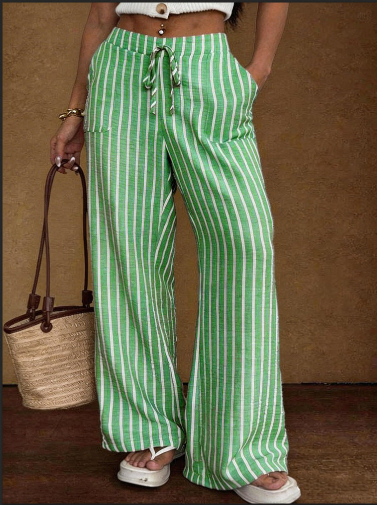 Women's striped wide-leg trousers with lace-up elastic waist and loose fit, by Plush Fashion Hub, shown in the image.