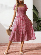 Floral print smocked ruffle sleeve midi dress from Trendsi, lightweight summer fashion, styled with flowy ruffles and a fitted bodice.