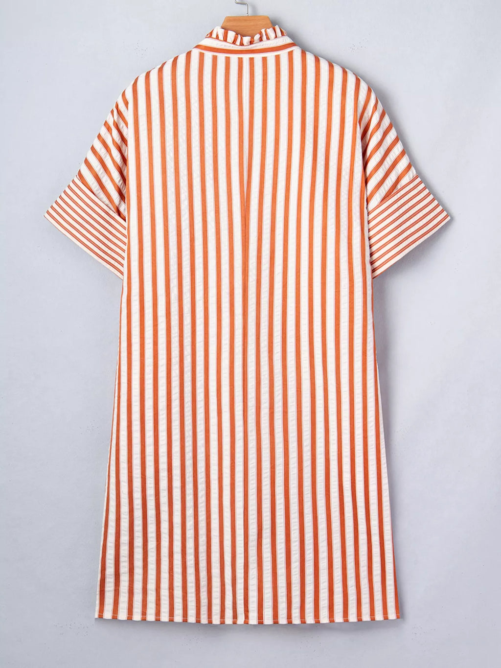 Stripe pinched V-neck mini dress with turn-up cuffs and pockets from Plush Fashion Hub, shown on a model.