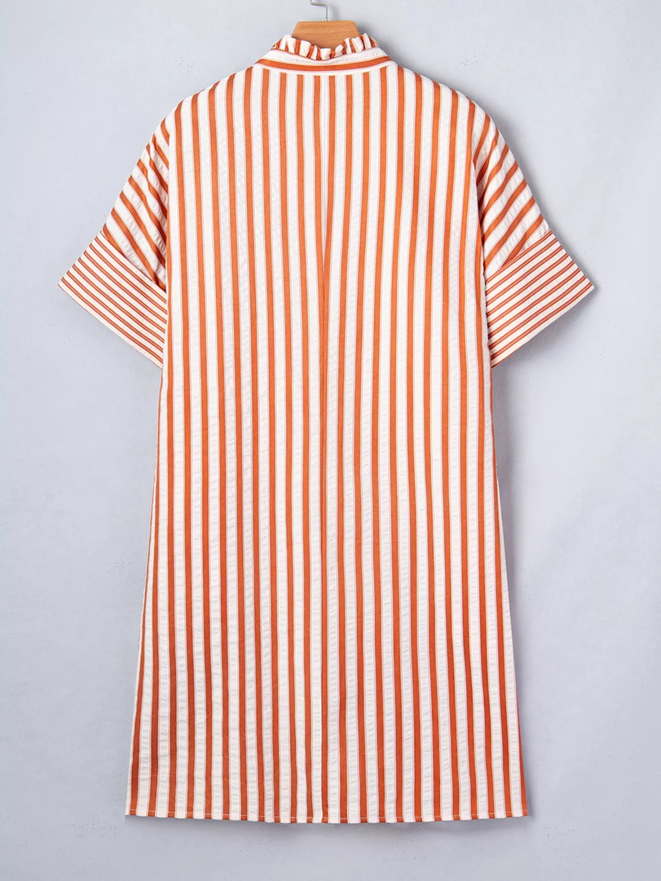Stripe pinched V-neck mini dress with turn-up cuffs and pockets from Plush Fashion Hub, shown on a model.