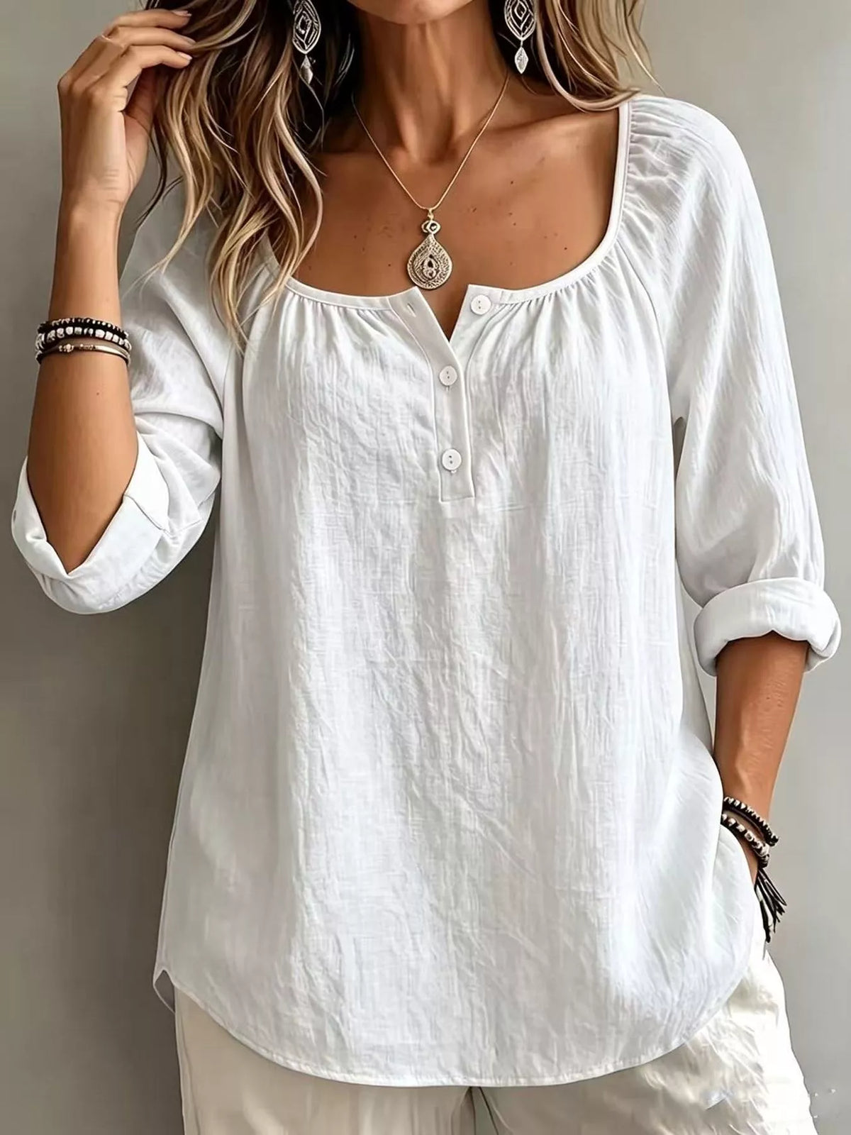 Plush Fashion Hub long sleeve top with button details, soft fabric, and a stylish fit, shown in a close-up image.