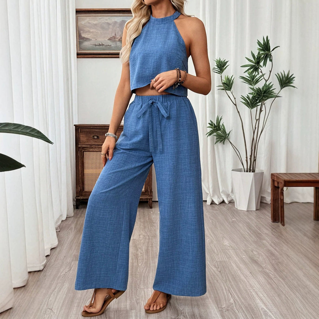 Women's casual two-piece set by FitiqueFit featuring a halter neck cropped top and wide-leg pants, perfect for relaxed style.