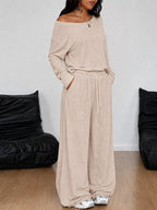 Plus size loose fit one-shoulder T-shirt and pants set by Trendsi, featuring comfortable, relaxed fit fabric and stylish design.