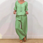 Women’s multi-color two-piece casualwear set with V-neck top and matching pants from Plush Fashion Hub, shown in a relaxed fit.