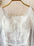 Women's elegant frill flounce sleeve smocked blouse in lightweight polyester, with stylish design and feminine details.