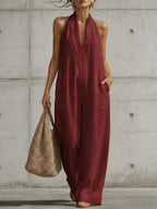 Plus size full body jumpsuit with halter neck and wide-leg design, stylish Trendsi women's fashion jumpsuit.