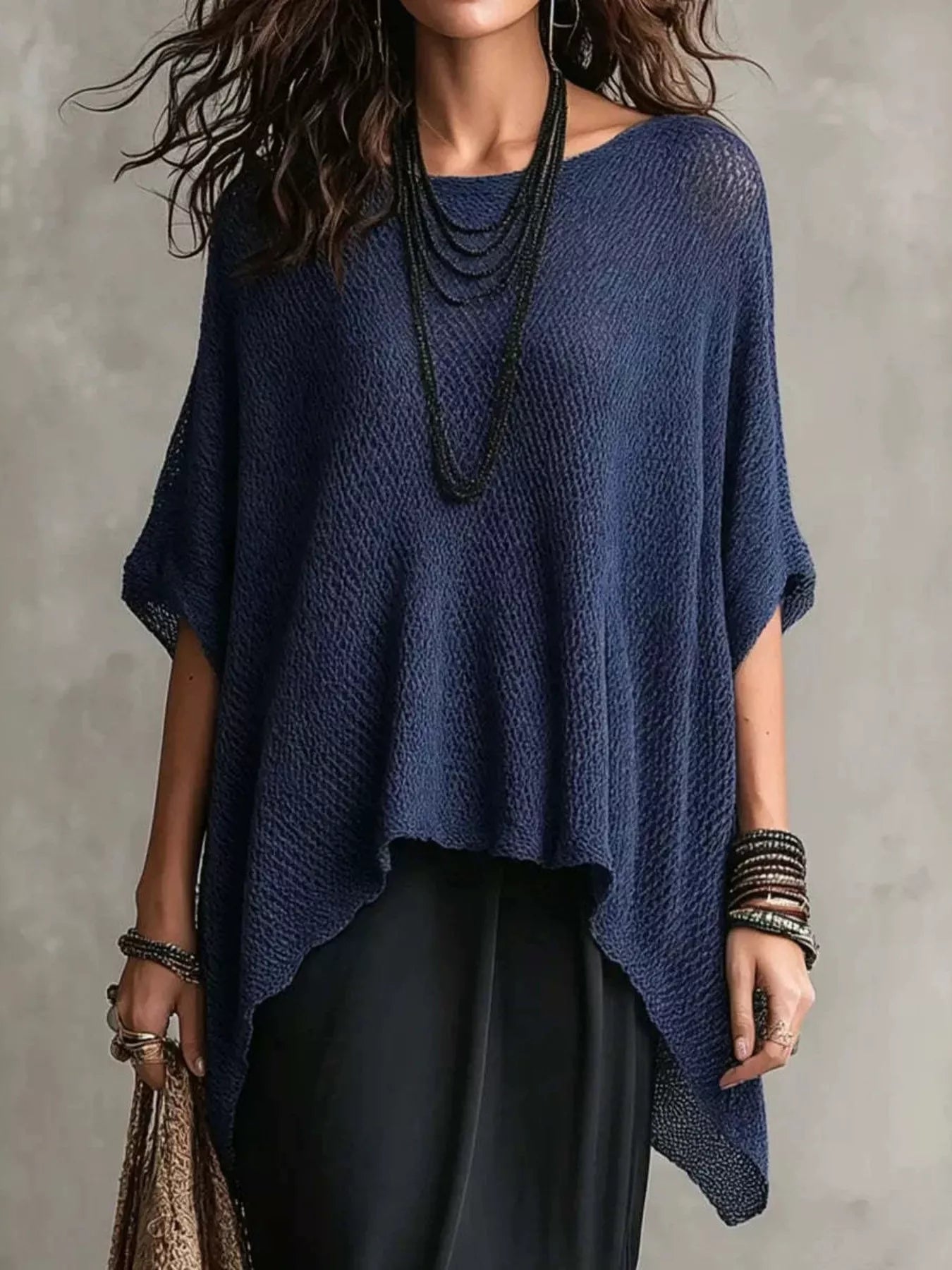 Plus size loose knit round neck top by Trendsi, featuring a full size, soft and cozy knit fabric in a casual style.