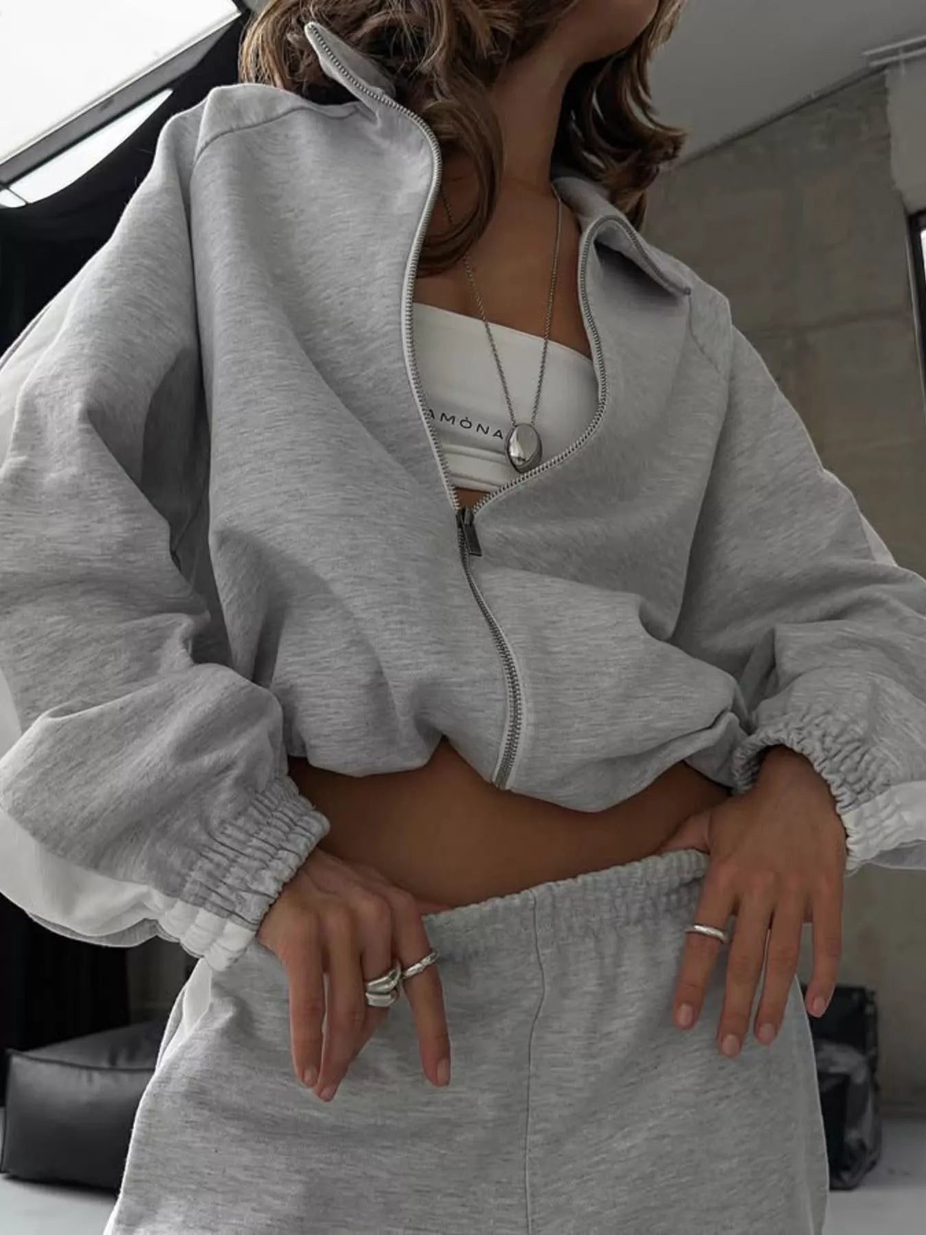 Plush Fashion Hub zip-up long sleeve tracksuit set in soft fabric, featuring a comfortable fit and stylish design.
