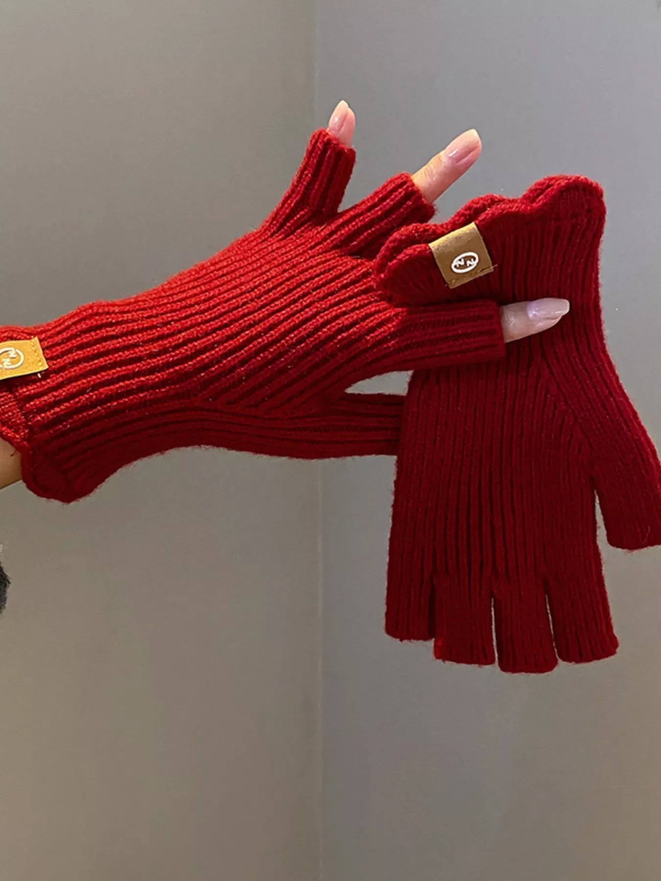 Simply Love fingerless knitted gloves in cozy, textured fabric, perfect for stylish warmth and easy movement.
