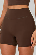 Fitglutes activewear two-piece set featuring a one-shoulder crop top and matching shorts for workout or gym wear.