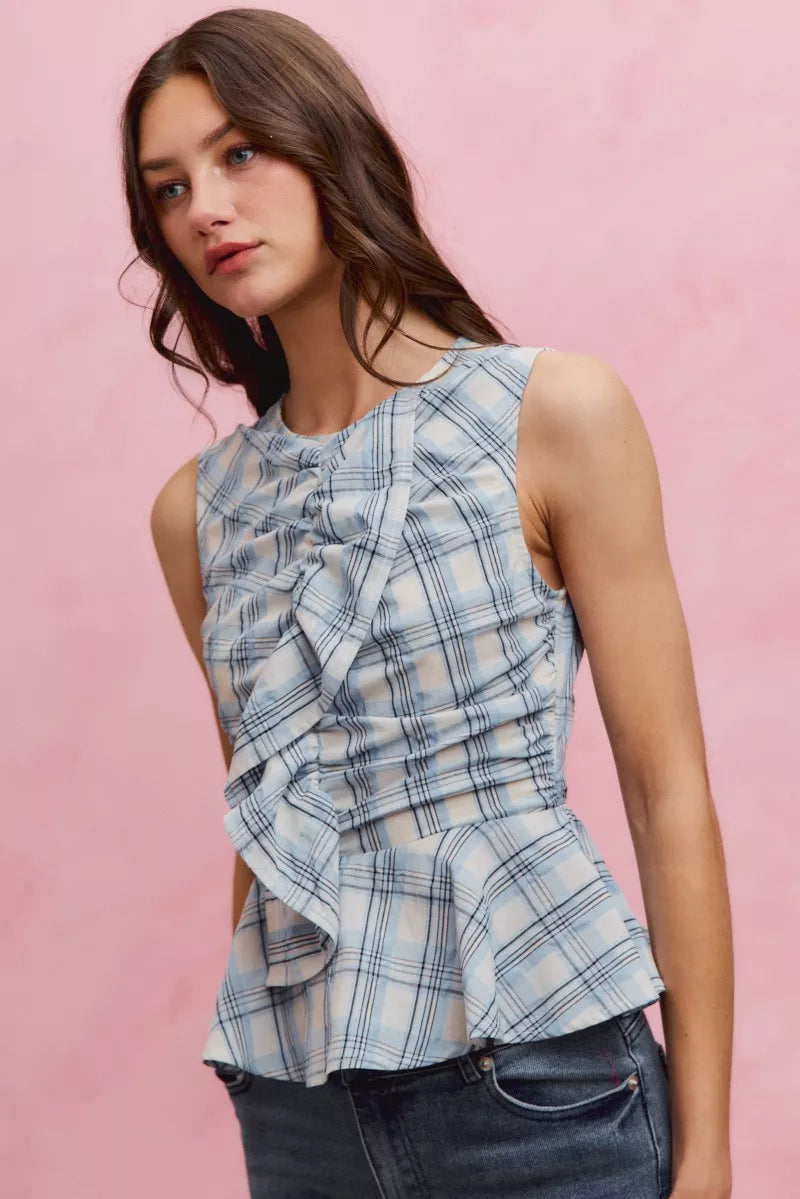 Plaid sleeveless ruffle peplum top from Plush Fashion Hub with a fitted silhouette and stylish ruffle details.
