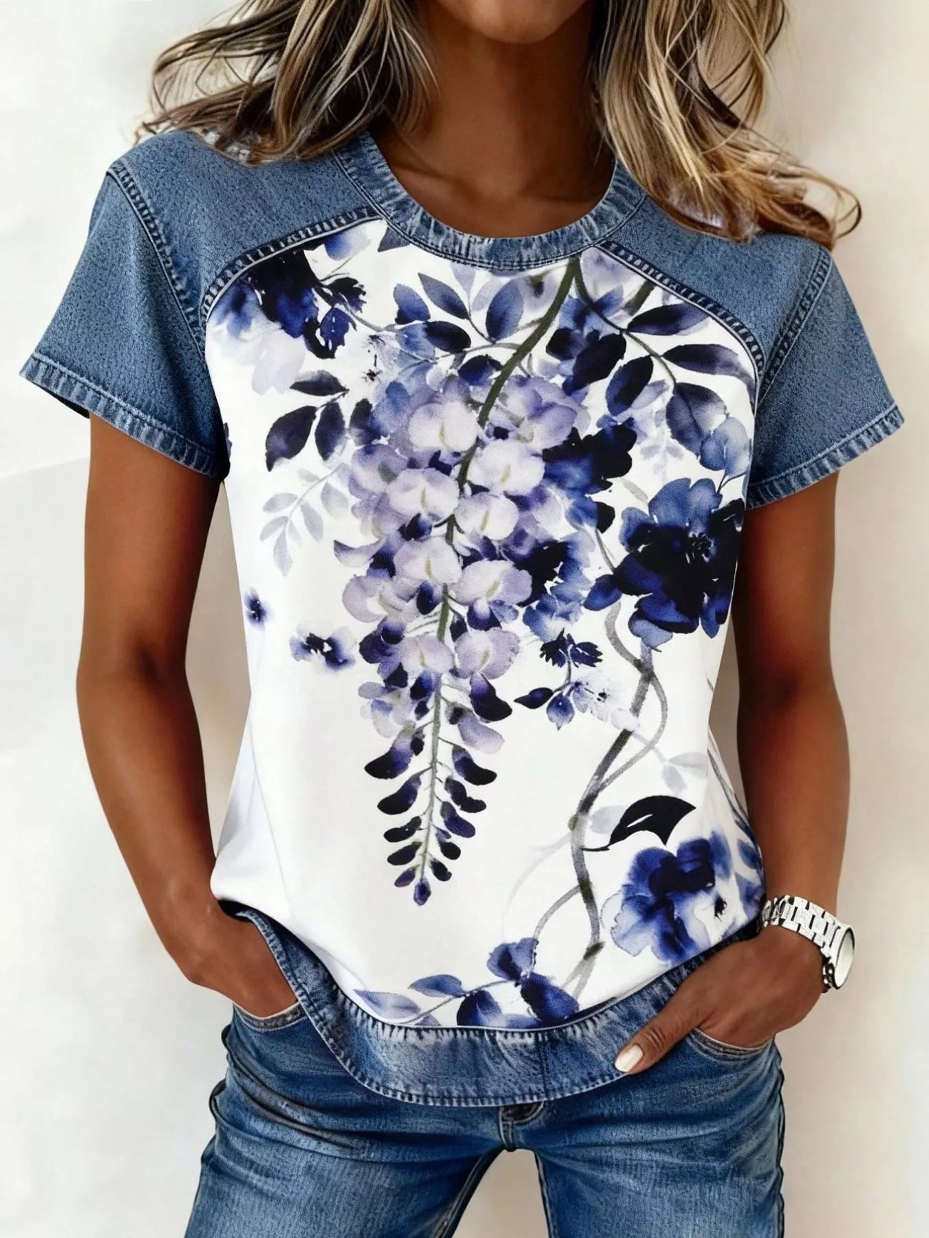 Denim patchwork short sleeve blouse from Plush Fashion Hub featuring mixed denim patches and a relaxed fit.
