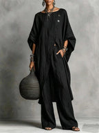 Women's casualwear set featuring a plush fashion hub drop shoulder three-quarter sleeve irregular shirt and matching pants.