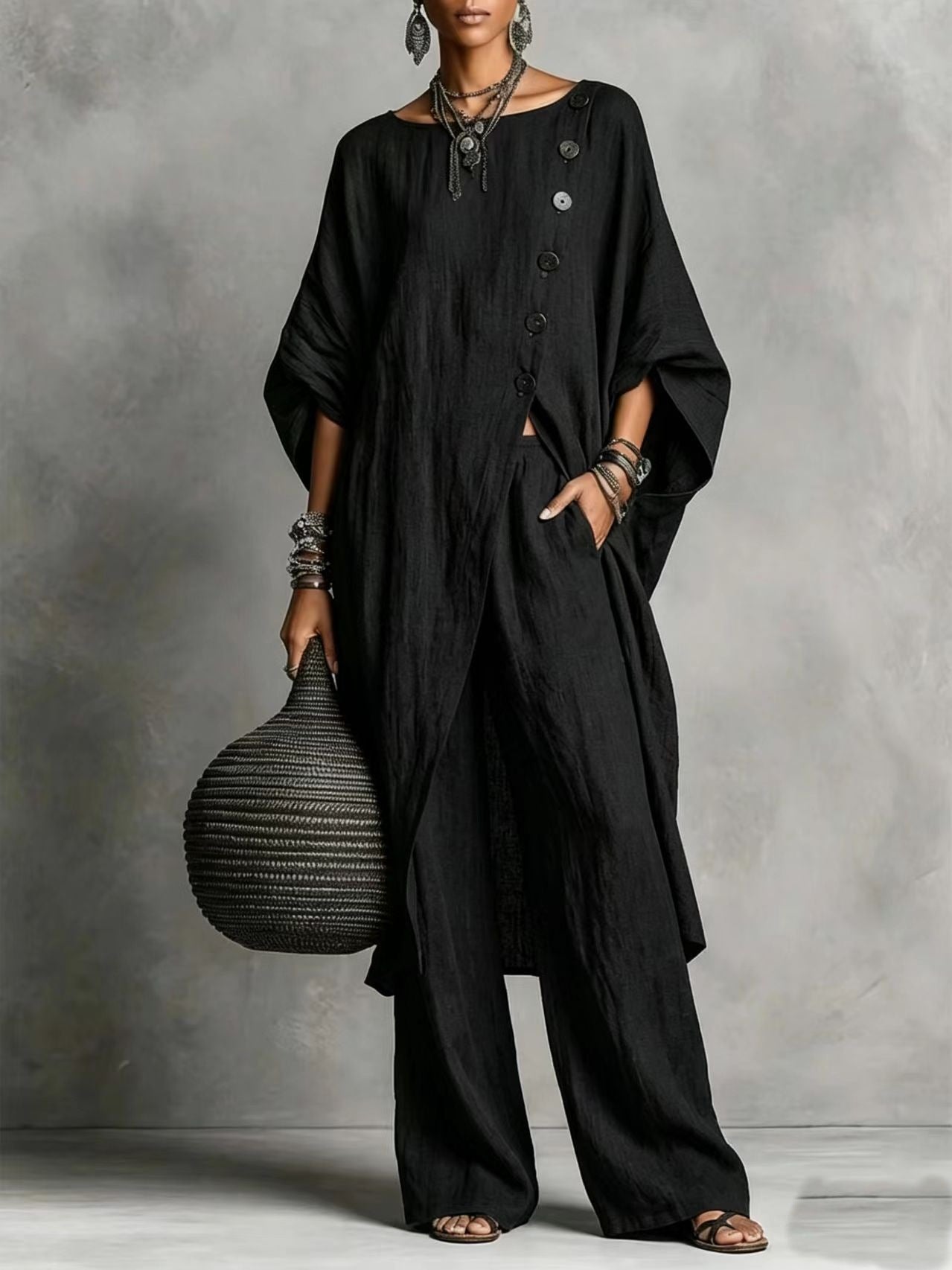 Women's casualwear set featuring a plush fashion hub drop shoulder three-quarter sleeve irregular shirt and matching pants.