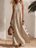 FitiqueFit sleeveless midi dress with side slits and loose fit, shown on a model in a casual indoor setting.