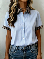 Women's leopard print short sleeve dress with contrast collar by Plush Fashion Hub, stylish and lightweight for casual wear.
