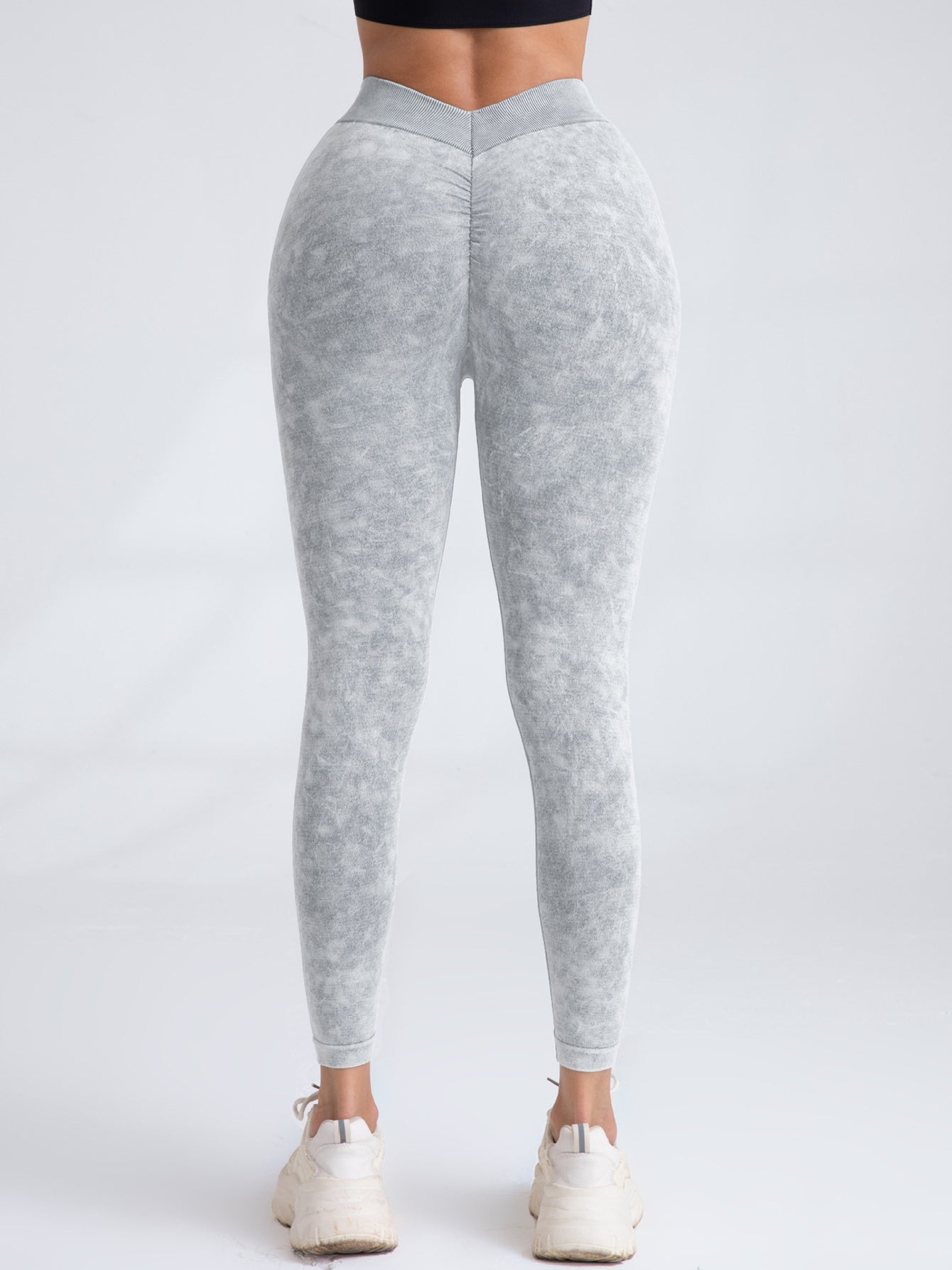 FitiqueFit V-back scrunch butt seamless yoga leggings showing high-waisted design and textured fabric for activewear.