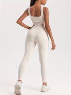 Women's ribbed sleeveless jumpsuit by FitiqueFit, activewear, fitted design with wide leg and ribbed texture, casual and stylish.