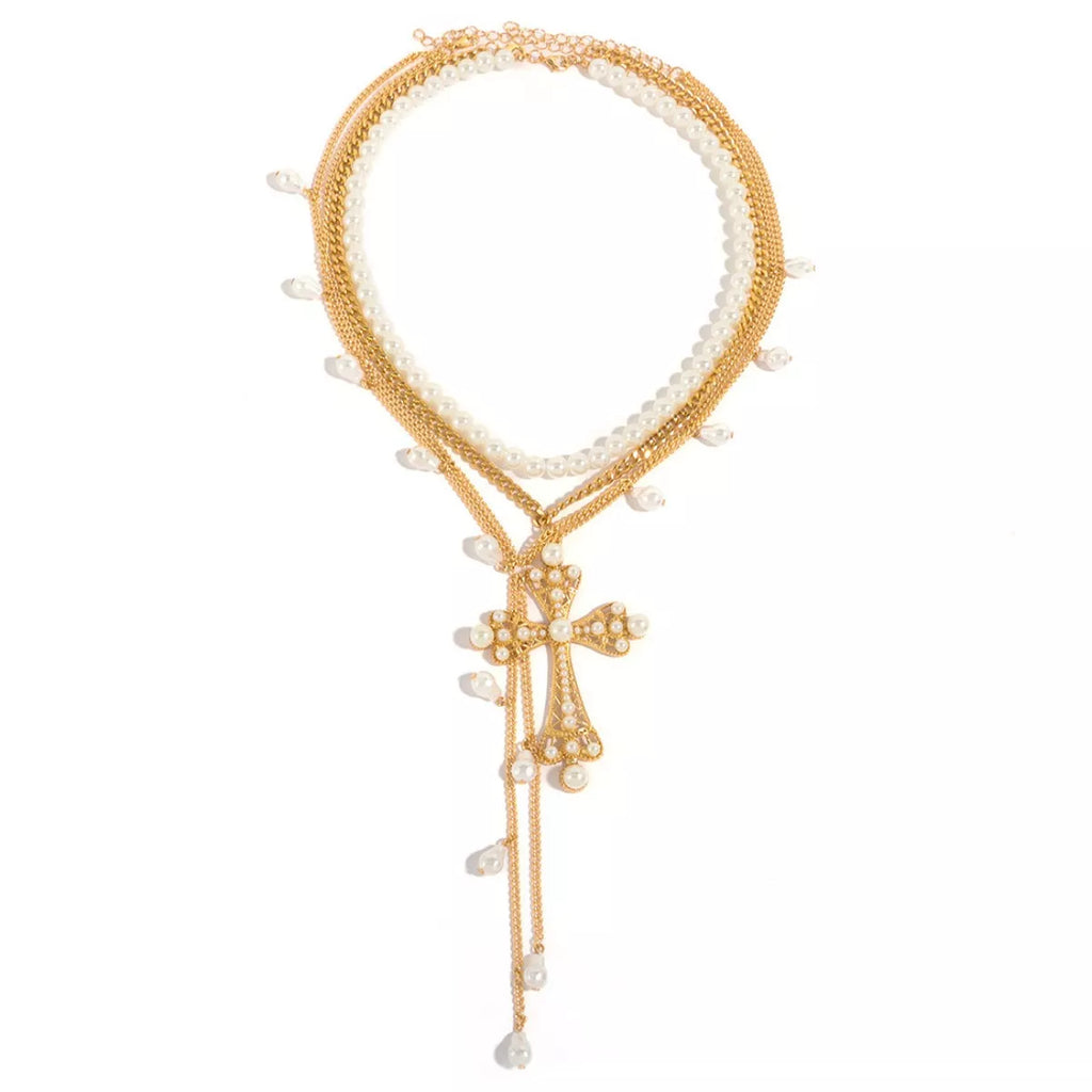 Set of three pearl cross pendant necklaces by Shopimist featuring elegant pearl and cross designs on silver chains.