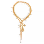 Set of three pearl cross pendant necklaces by Shopimist featuring elegant pearl and cross designs on silver chains.