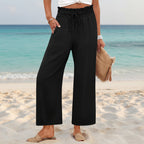 Women's wide-leg cropped pants by FitiqueFit with lace trim and pocket details, shown in a relaxed fit and lightweight fabric.