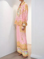 Women's printed lantern sleeve top and matching lounge pants set by Trendsi, comfortable and stylish for casual wear.