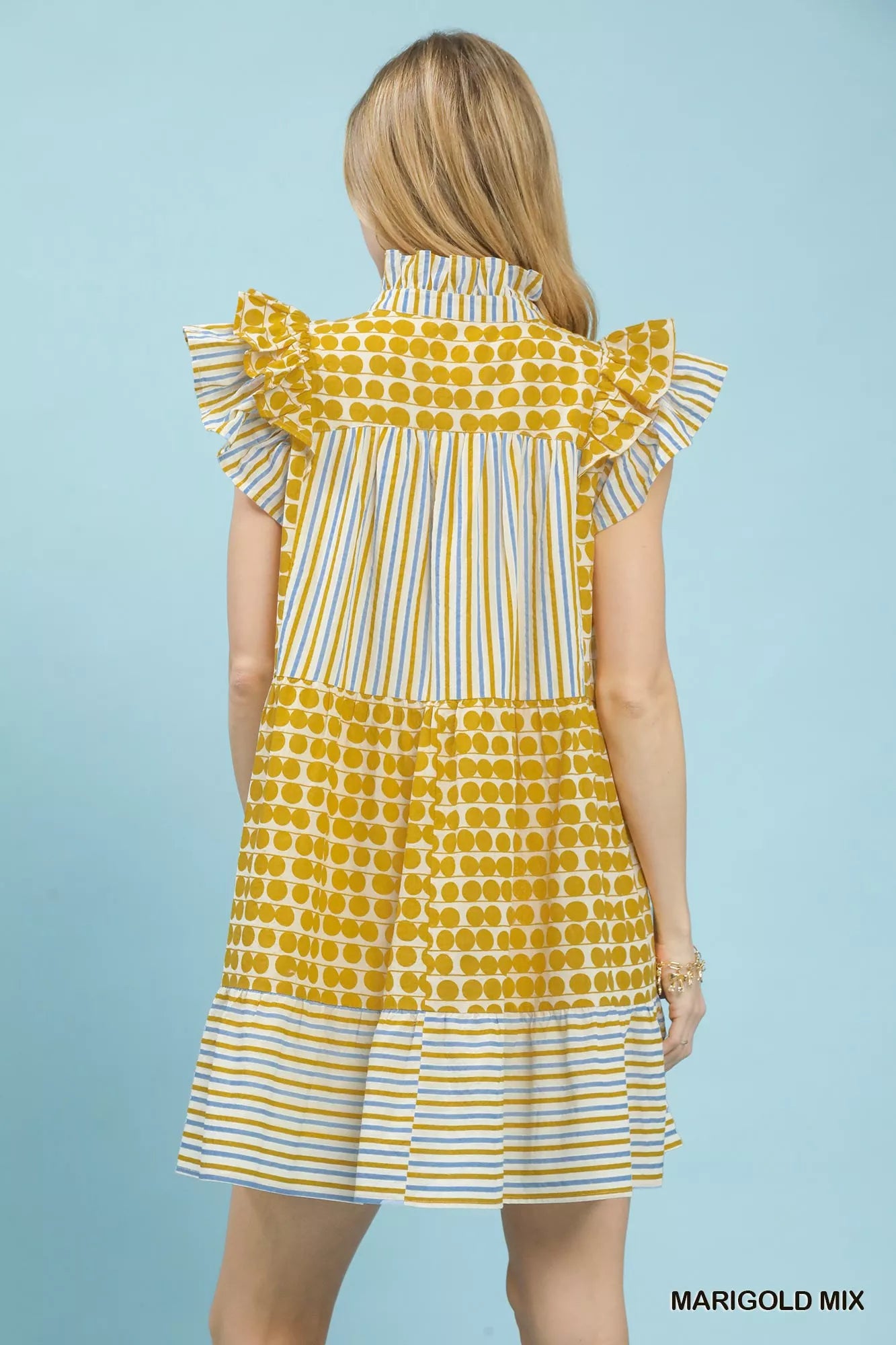 Umgee Mix Patchwork Flutter Sleeve Tiered Dress with boho style, showcasing colorful patchwork fabric and flowing silhouette.